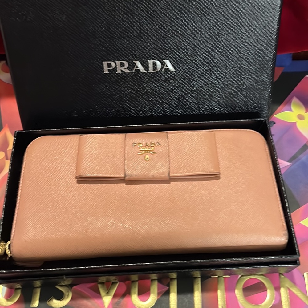 Authentic Prada long zip around bow wallet